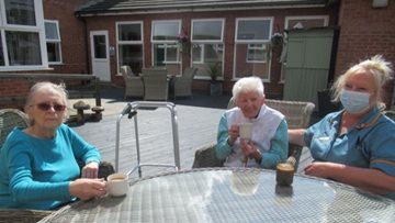 Birmingham care home Residents enjoy coffee morning in the garden